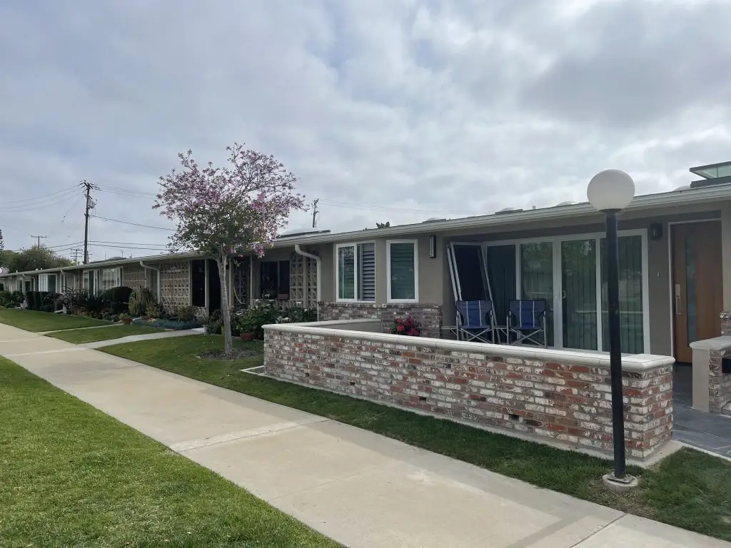 Attached homes in Leisure World Seal Beach featuring private patios, landscaped pathways, and community amenities, ideal for 55+ residents seeking comfortable living.