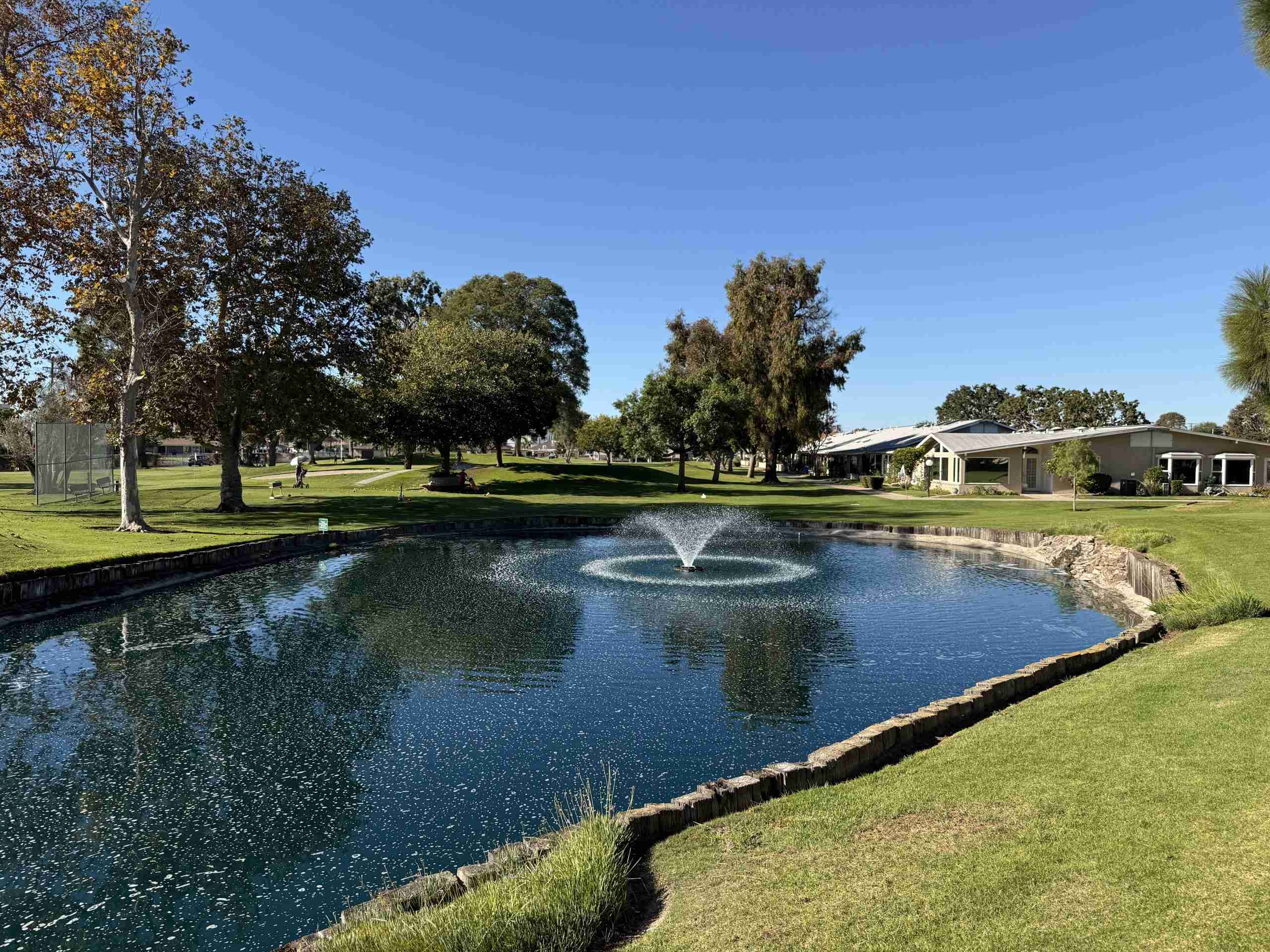Scenic view of Leisure World Seal Beach community with pond and fountain.