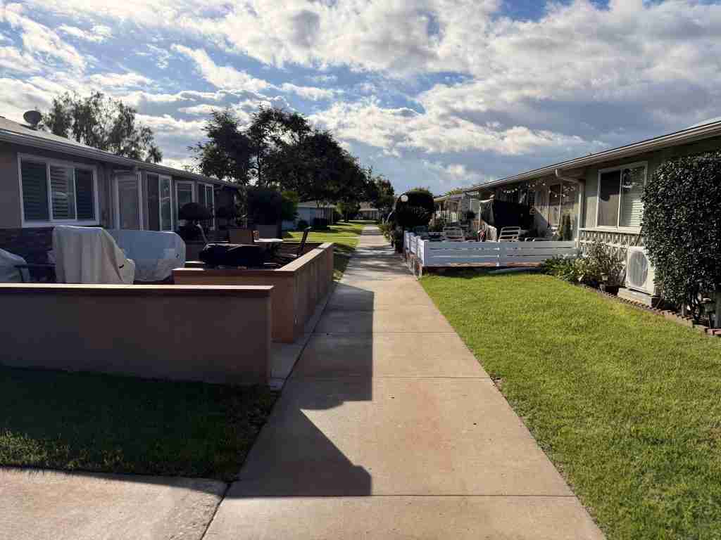 Homes in Mutual 1, Leisure World Seal Beach, California, with landscaped walkways and patios.